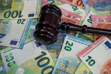 Close-up of multiple 100 euro banknotes spread out, symbolizing finance, savings, and investment