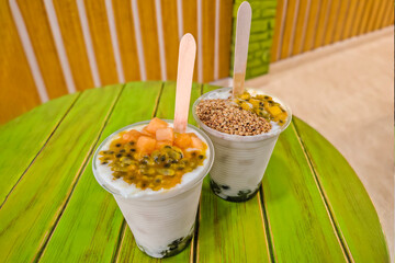 Layered fruit salad with soursop, passion fruit, mango, melon, and kiwi—typical Colombian fruits.