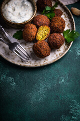 Middle Eastern falafel balls with sauce