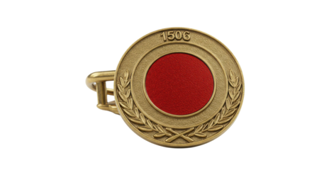 Vintage cufflink with red center on white background