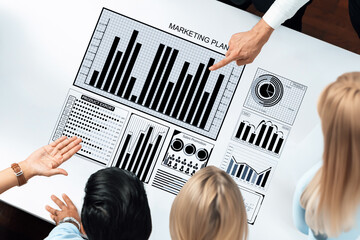 Team members collaborate over a marketing plan, analyzing various data visualizations and metrics to drive business growth in a modern office environment. Axiom