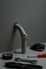 Hyper-realistic image of a damaged conduit pipe in a wall with sparks, depicting an emergency scenario