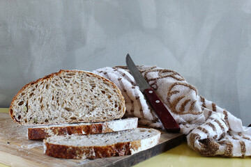 Sliced bread and knife on the cutting board. Brazilian breakfast.