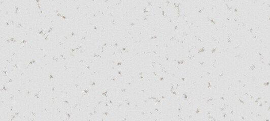 closeup of white acoustic ceiling tile with scattered brown specks, textured surface for sound...