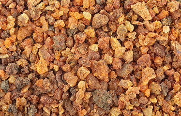 Aromatic natural Commiphora myrrha as background, top view. Gum resin, fragrances, Sudanese Frankincense tree. Incense.