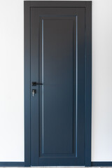 Blue door with keys. Matte minimalism. Black hardware.