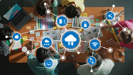 This image showcases a vibrant and collaborative computing environment where a team engages in creative project development with cloud technology for enhanced productivity. Amity