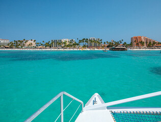 Caribbean coastline view from catamaran turquoise water