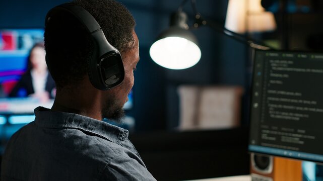 Male developer entering binary data on terminal panel while writing html code. Software engineer working on troubleshooting with programming language, internet and server security. Camera B. - Powered by Adobe