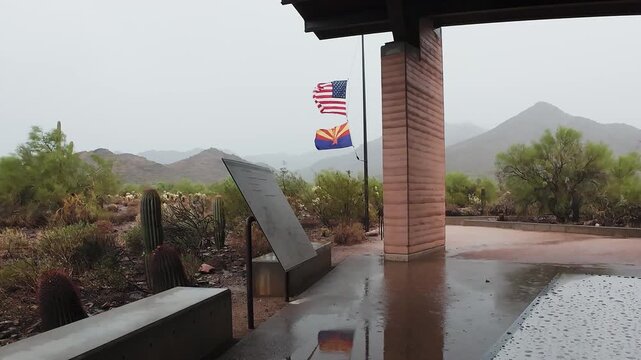 American And Arizona State Flag Blowing In Wind During Stormy Weather In Scottsdale AZ