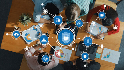 Team Collaboration on Cybersecurity Strategies with Data Visualization and Lock Icons Representing Security Measures in a Modern Office. Amity