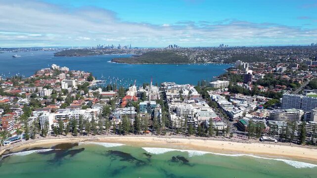 Sydney, Australia : Aerial drone footage of Manly beach and the city famous skyline in the background. Located in northern Sydney, New South Wales, Australia