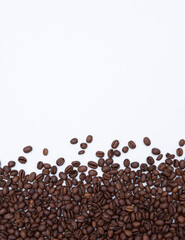 roasted coffee scattered on a white background