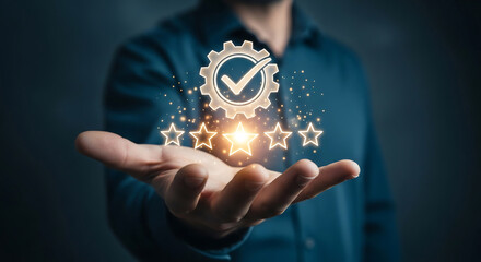 A hand holding five stars, a cogwheel with a checkmark, and sparkling lights