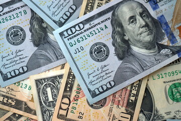 Big amount of different dollar bills close up. Hundred fifty twenty ten and five dollar banknotes