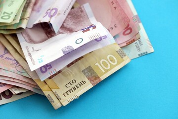 Big amount of different Ukrainian hryvnia money bills. Pile of crumpled ukrainian banknotes