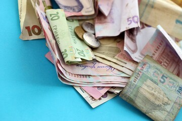 Big amount of different Ukrainian hryvnia money bills. Pile of crumpled ukrainian banknotes
