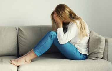 Upset sad crying woman while experiencing mental suffering, depression, fatigue, emotional stress