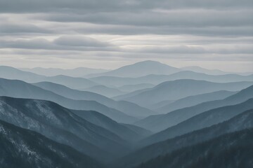 Obraz premium Majestic mountain valley with layered snowy peaks under a cloudy sky, tranquil winter landscape with scenic seasonal beauty, peaceful natural environment and icy horizon