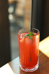 Summer iced refreshing lemon strawberry cocktail.