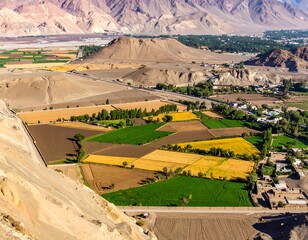 High-angle view of a valley with fields of various colors