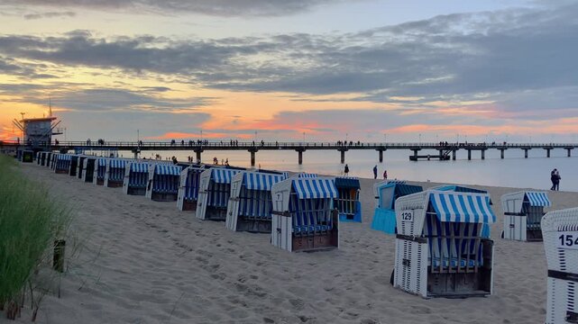 Evening at the Zinnowitz pier on Usedom Island, with traditional beach chairs