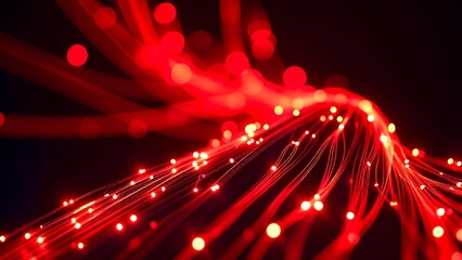 A vibrant display of red light trails, creating a dynamic and abstract composition against a dark background.