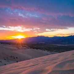 Fototapeta premium Sunset over sand dunes and mountains