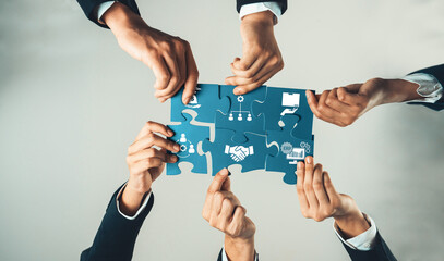 Top view panorama banner of business team assembling jigsaw puzzle over table symbolize business partnership and collective teamwork for HR recruitment and job seeker background. Shrewd Amity