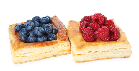 Yummy puff pastries with berries isolated on white