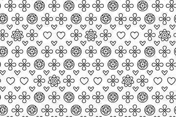 Black and white floral pattern featuring hearts and flowers, creating a playful and whimsical design suitable for various creative projects and backgrounds