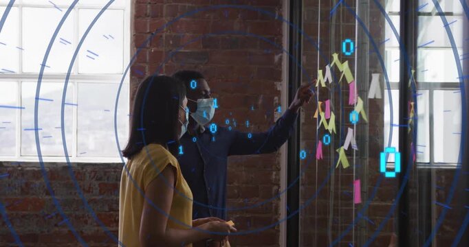 Colleagues selecting notes, building grid on glass wall with binary code drifting for tech planning