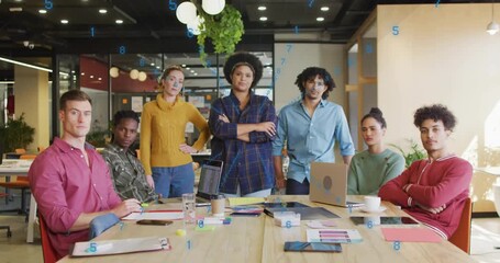 Finance team of seven analyzing charts at desk while blue data stream animating enhancing meeting - Powered by Adobe