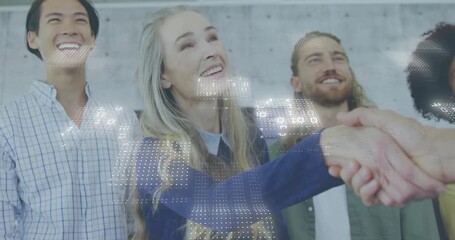 Mature tech lead initiating handshake to seal deal while team watching and binary code drifting - Powered by Adobe