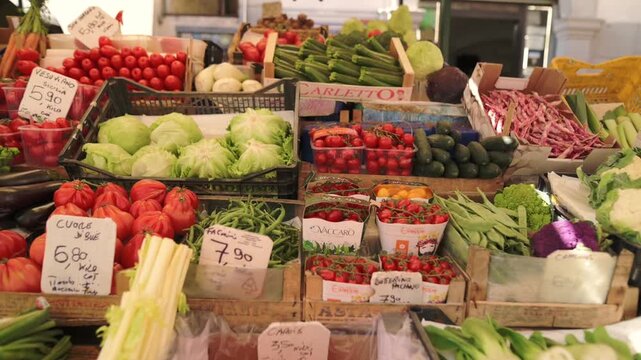 Abundant vegetable stand full of natural Italian farm produce Outdoor produce market with fresh vegetables and handwritten price signs