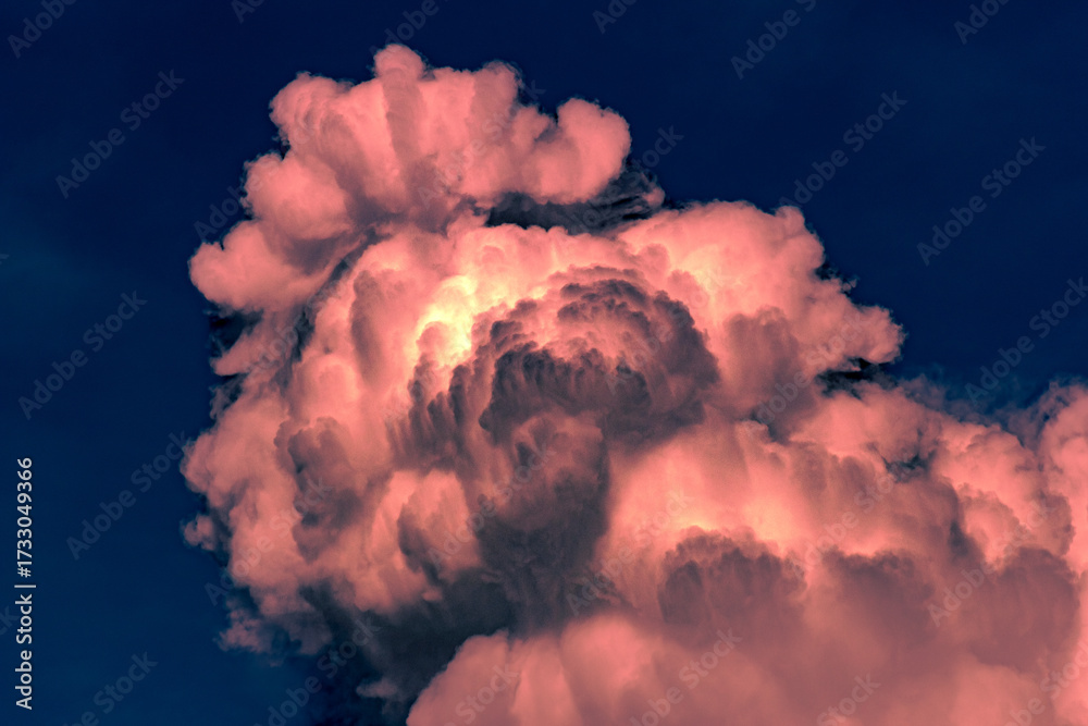 Wall mural clouds in the blue sky before a thunderstorm. toned.