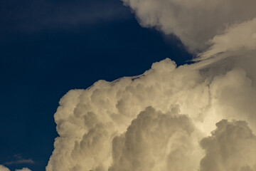 Clouds in the blue sky before a thunderstorm. Toned.