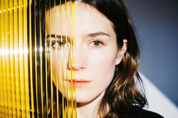 Abstract woman portrait with glass texture. Glitched and corrupted female face. Beautiful girl. Model hidden behind mirror pattern. Colored Reeded Glass. Ribbed Background.