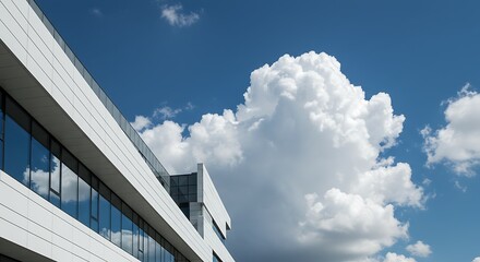Modern architectural building against a blue sky with white clouds