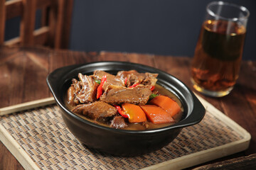 Braised Goose with Vegetables in Iron Skillet - Traditional Farmhouse Kitchen Dish