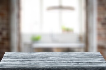 Empty wooden table with blur room background