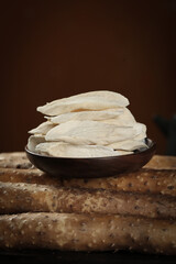 Fresh Yam Slices in Rustic Bowl on Wooden Table - Healthy Root Vegetable Ingredient