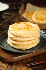 Chinese Layered Flatbread Pastry on Wooden Table - Traditional Asian Breakfast Cuisine