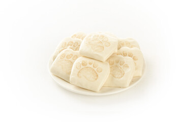 White Bear Paw Print Sandwich Cookies on Plate Isolated on White Background
