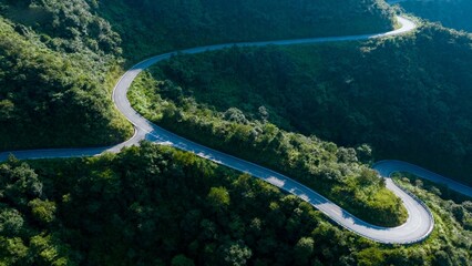 Winding road through forested hills