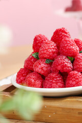 Fresh Red Raspberries with Mint on White Plate - Healthy Organic Fruit Food Photography