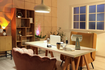 Interior of studio with podcaster's workplace and glowing lamps