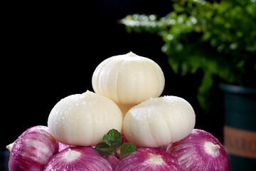 Fresh Peeled Garlic Bulbs with Purple Red Onions and Mint Garnish for Healthy Cooking