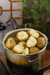 Traditional Gansu Style Cooked Potatoes with Yellow Centers in Metal Pot