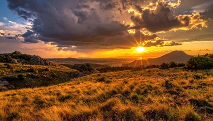 Dramatic Sunset Over Golden Meadow and Distant Hills with Vivid Colors and Atmospheric Clouds Rural Landscape Photography